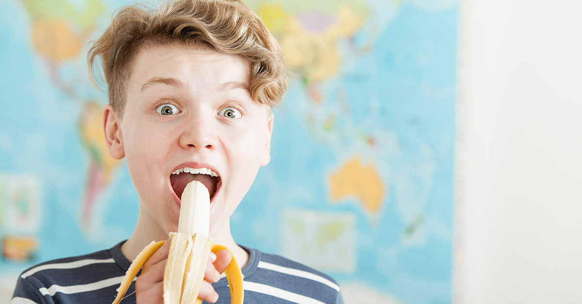 student eating banana