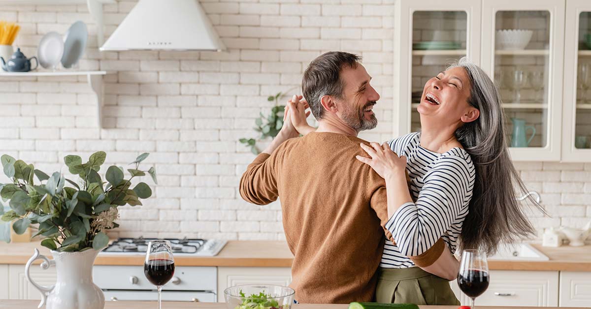 Couple dancing in kitchen. True love concept. Happy couple