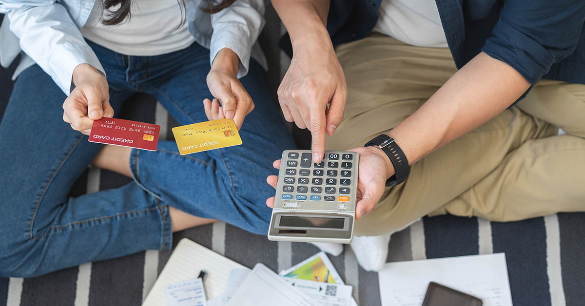 couple calculating and budgeting