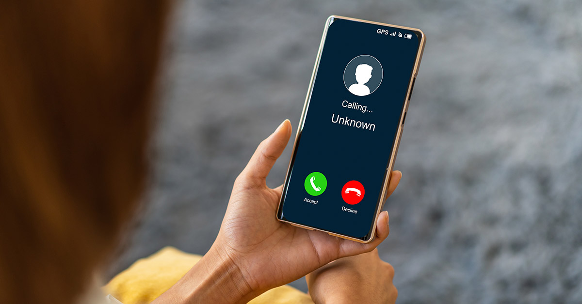 person looking at their cell phone with an incoming call
