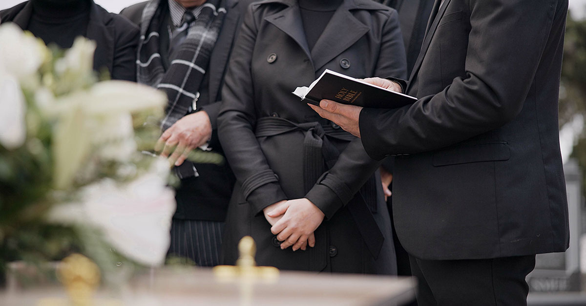 Paster reading at funeral