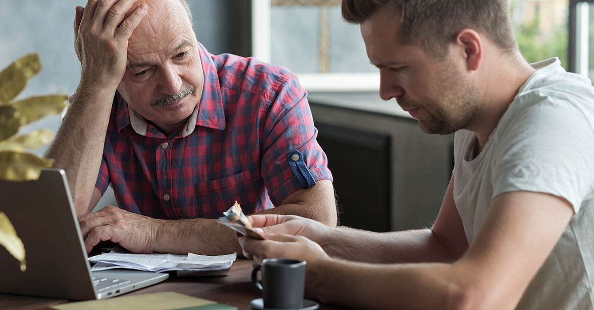 Father and son discussing money problems