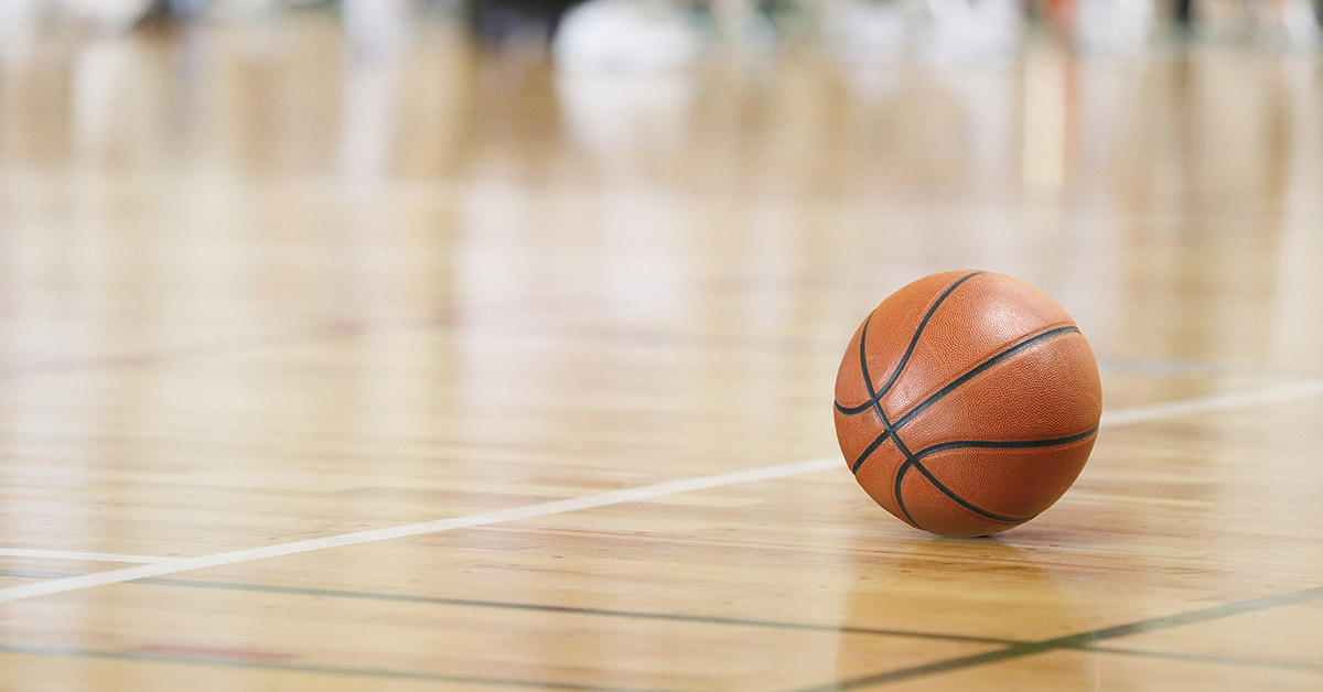 Basketball on gymnasium floor