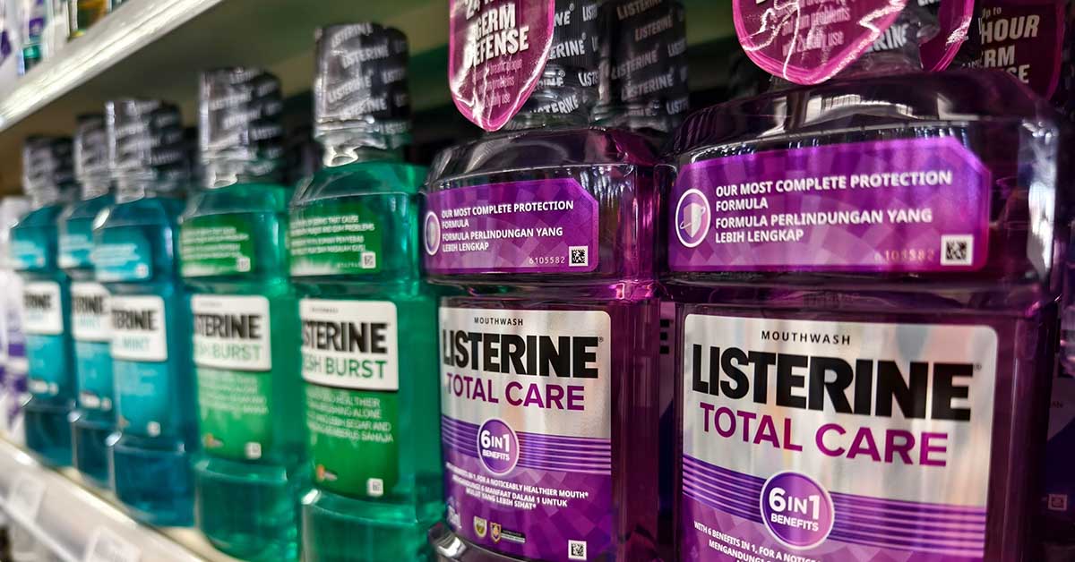 bottles of Listerine on shelf in supermarket