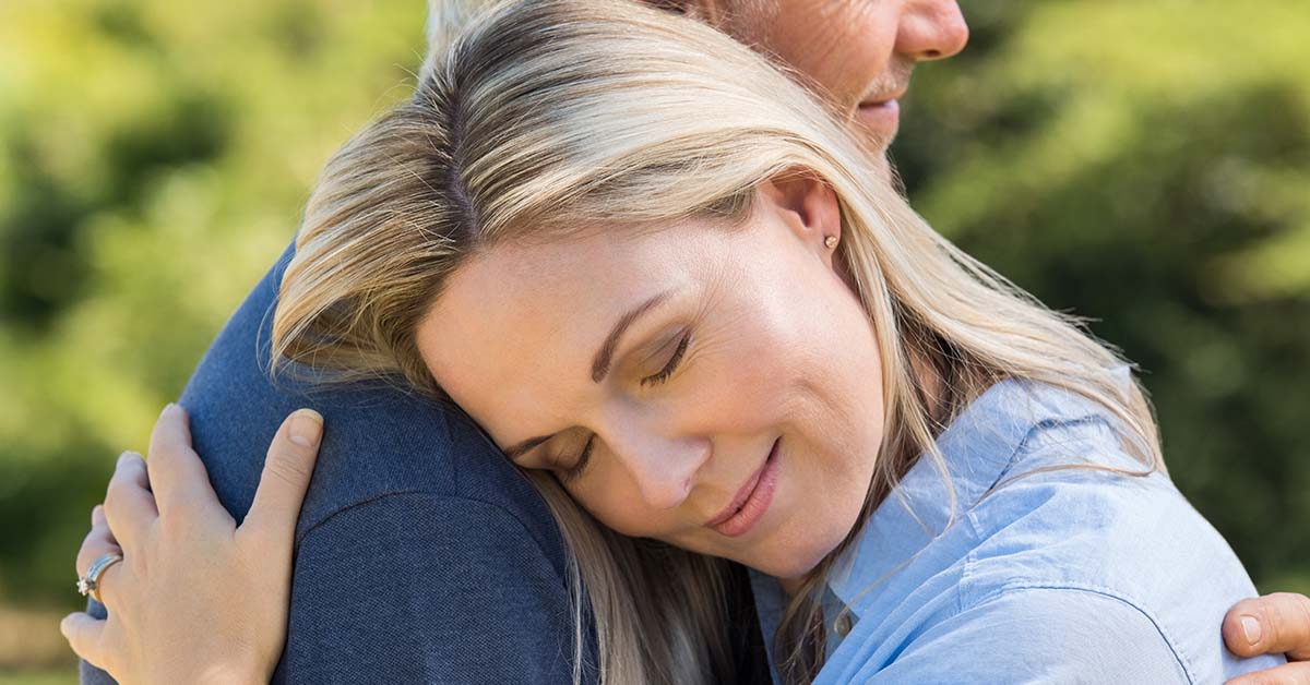 Husband and wife embracing