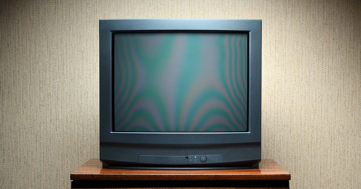 Black CTR tube television set on a small brown table