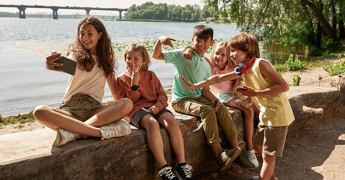 Adolescents hanging out by the water