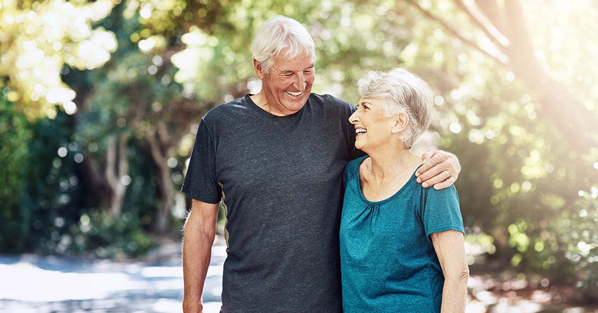 elderly couple walking park on nice sunny day. Happy retirement concept
