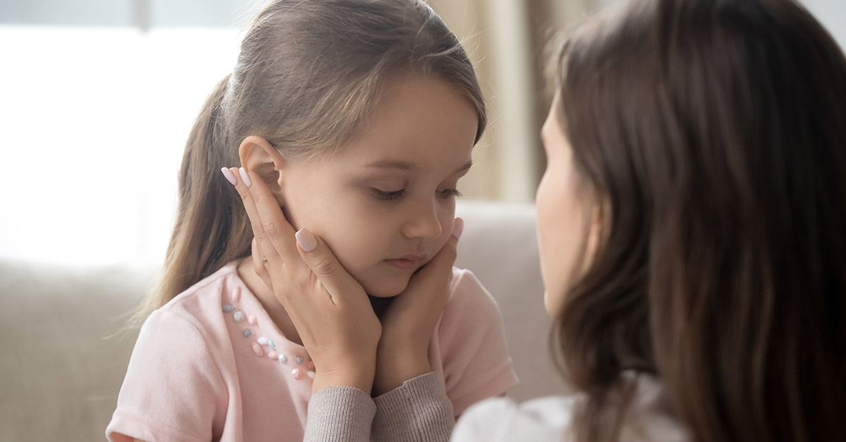 mother consoling small child