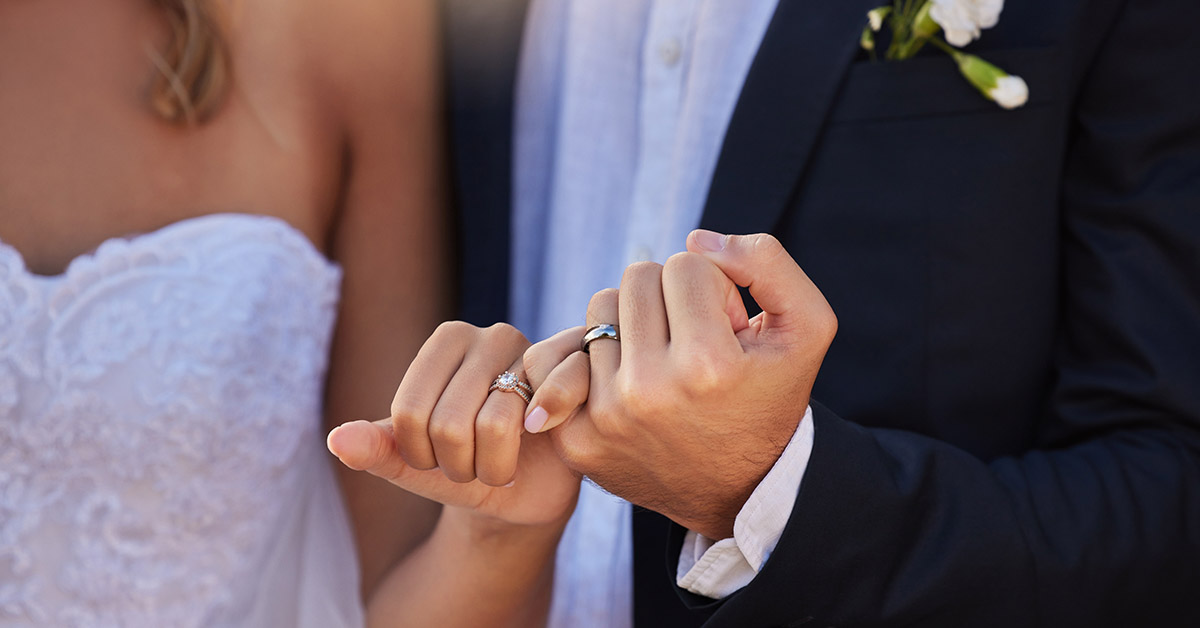Bride and Groom holding hands