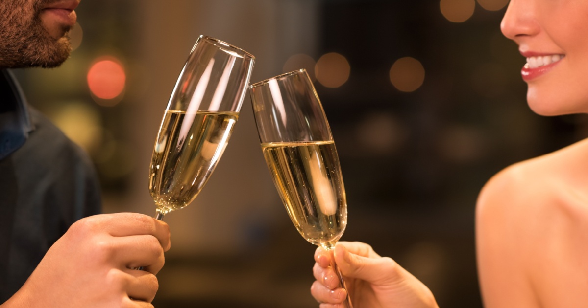 couple holding champagne glasses