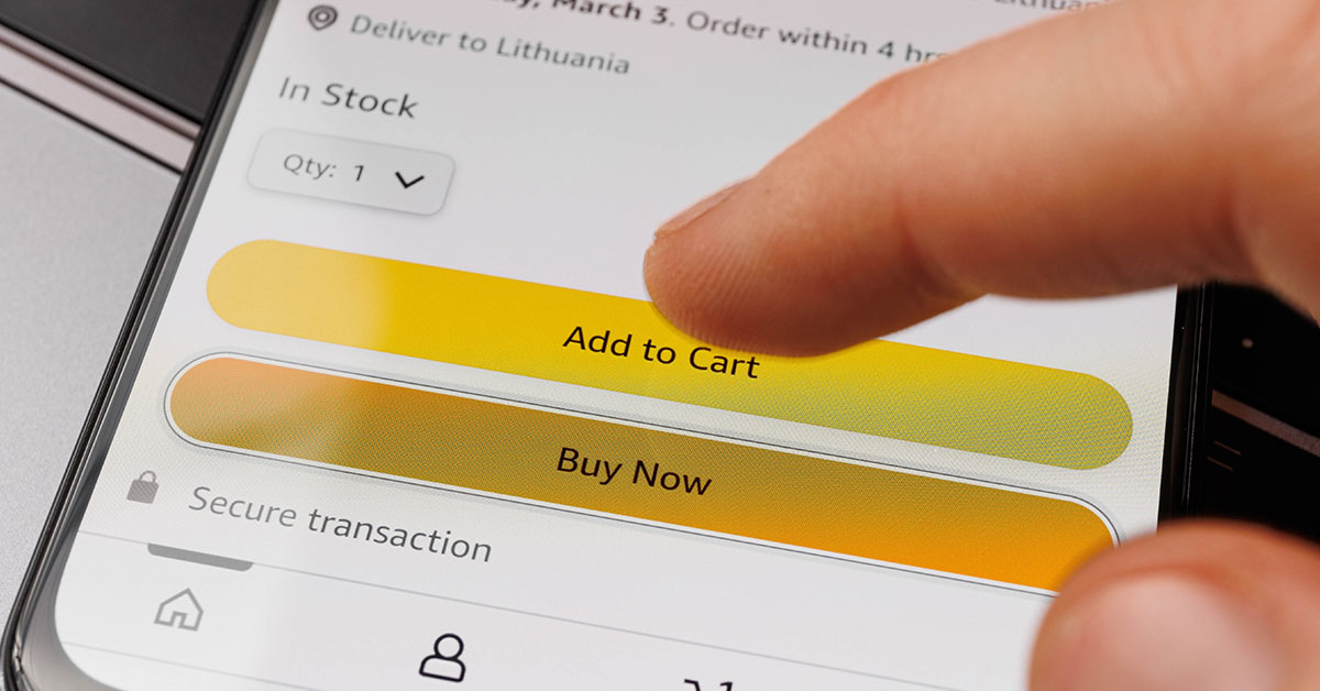 person tapping on "add to cart button" while using Amazon app on smartphone