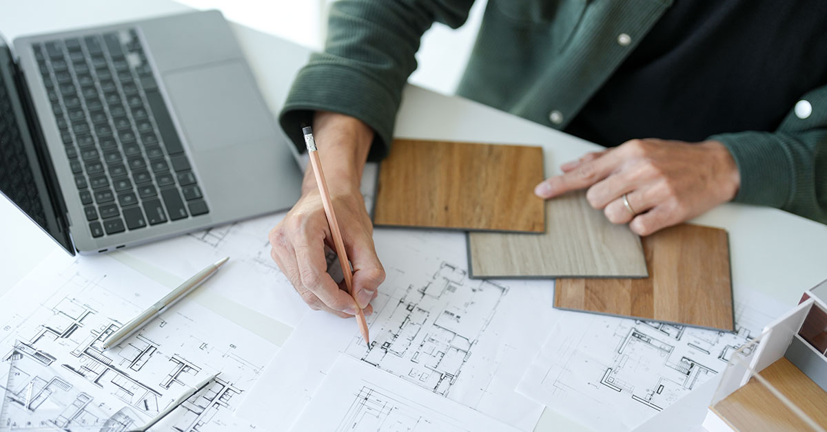 person drawing up drafting layouts. Architecture concept