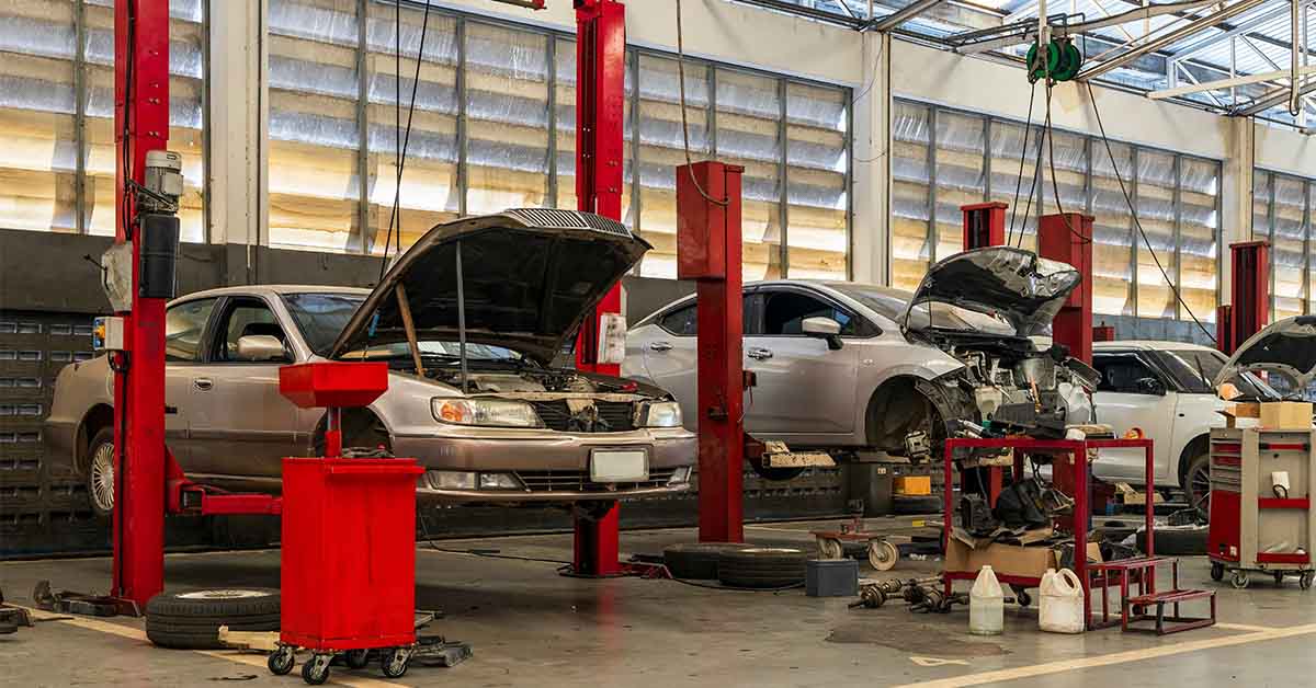 auto repair shop with cars on lifts