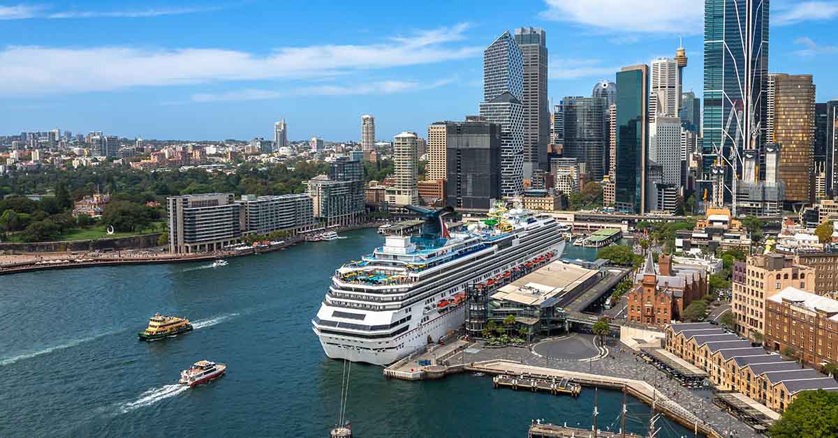 Cruise ship docked at a city harbour / dock