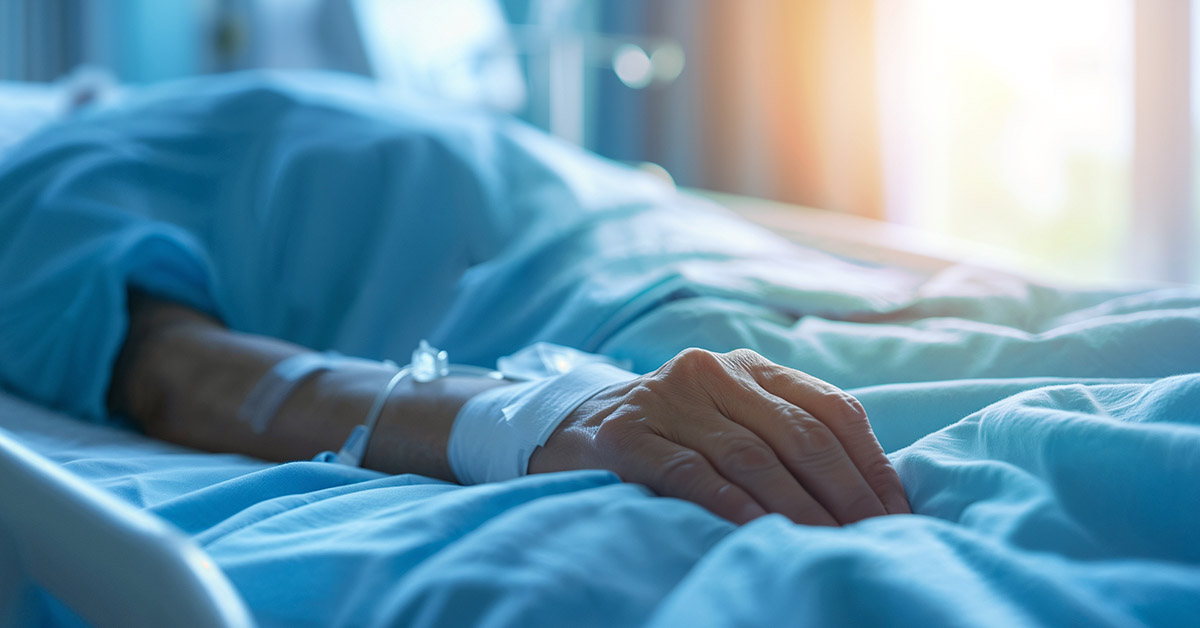 person in hospital bed. End of life concept
