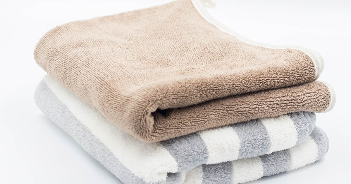 bath towels folded and stacked on one another