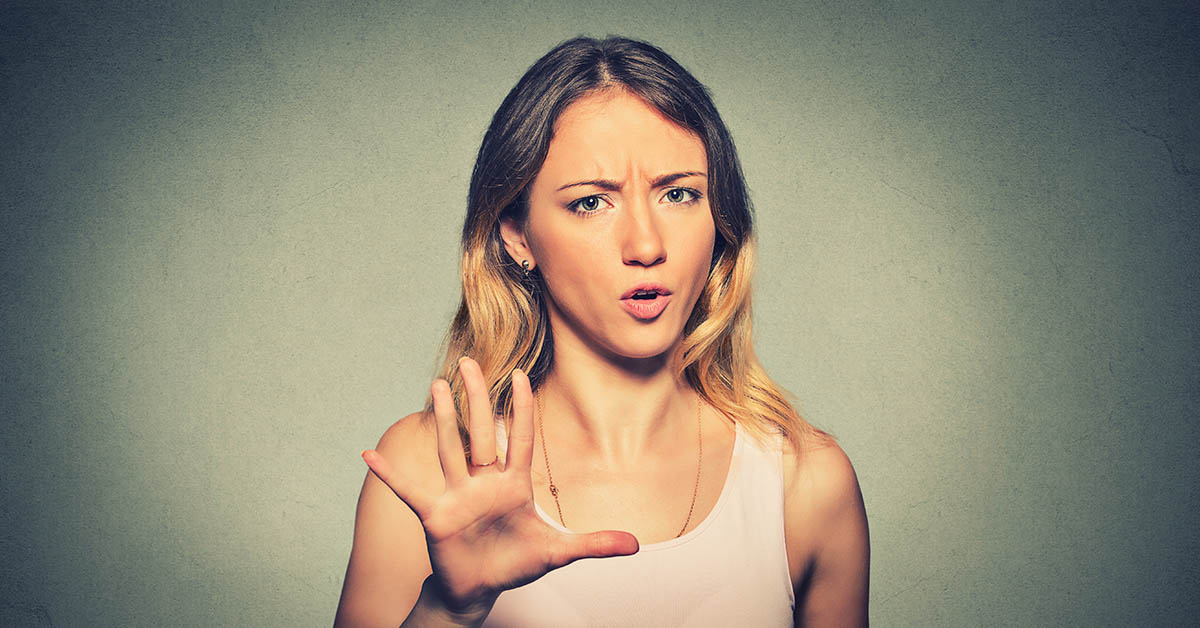 woman with hand up