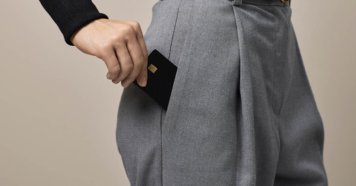 woman putting something into her pant's pocket