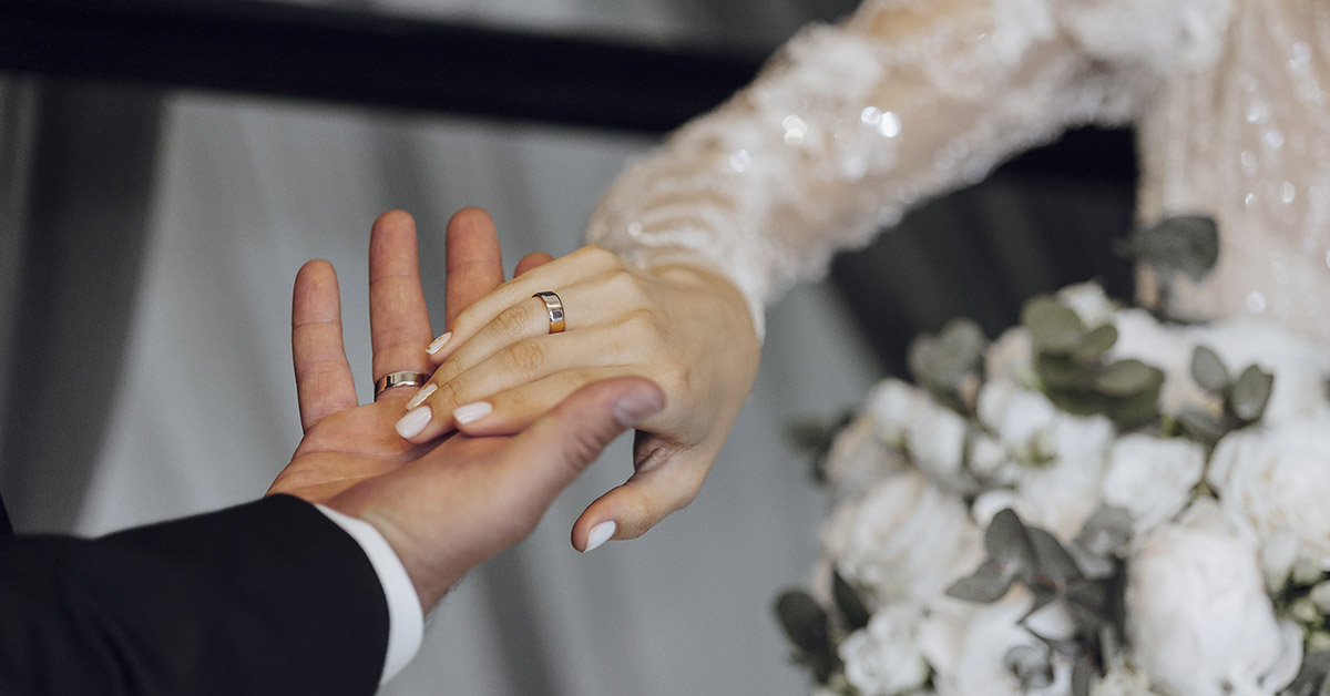 bride and groom, close up of holding hands