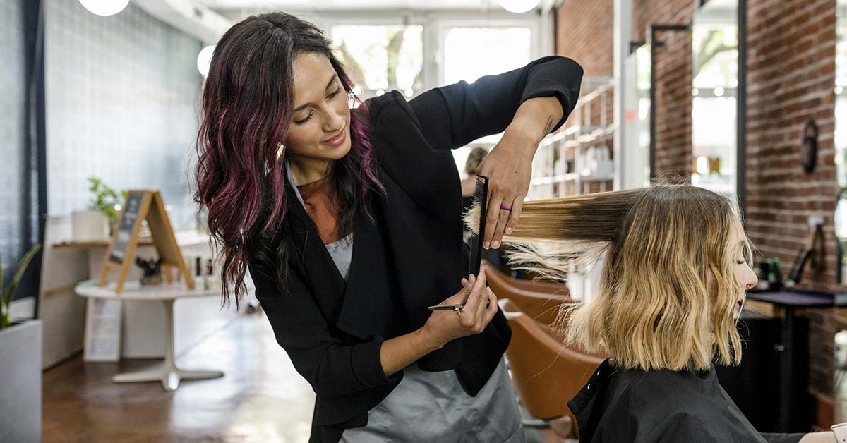 woman at a salon getting her her done. haircut transformation
