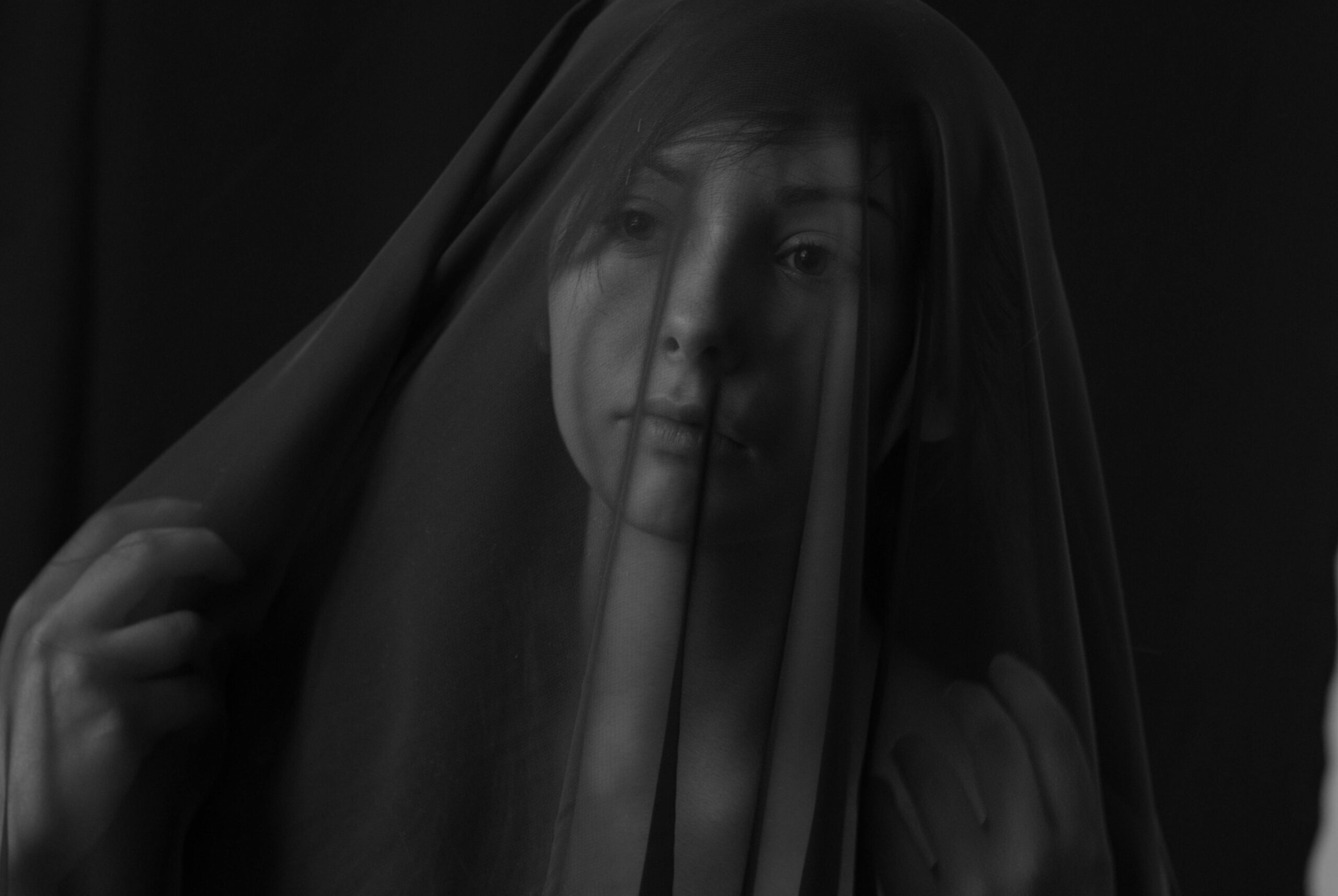 A woman with veil covering her face