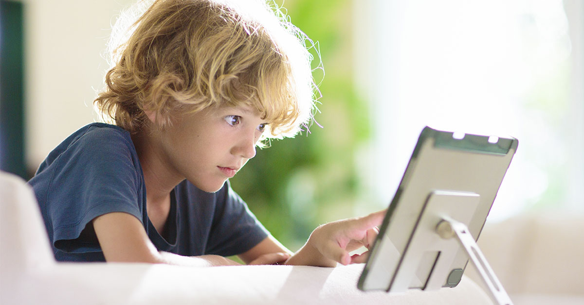 young boy using a tablet
